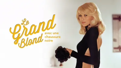 LE GRAND BLOND AVEC UNE CHAUSSURE NOIRE