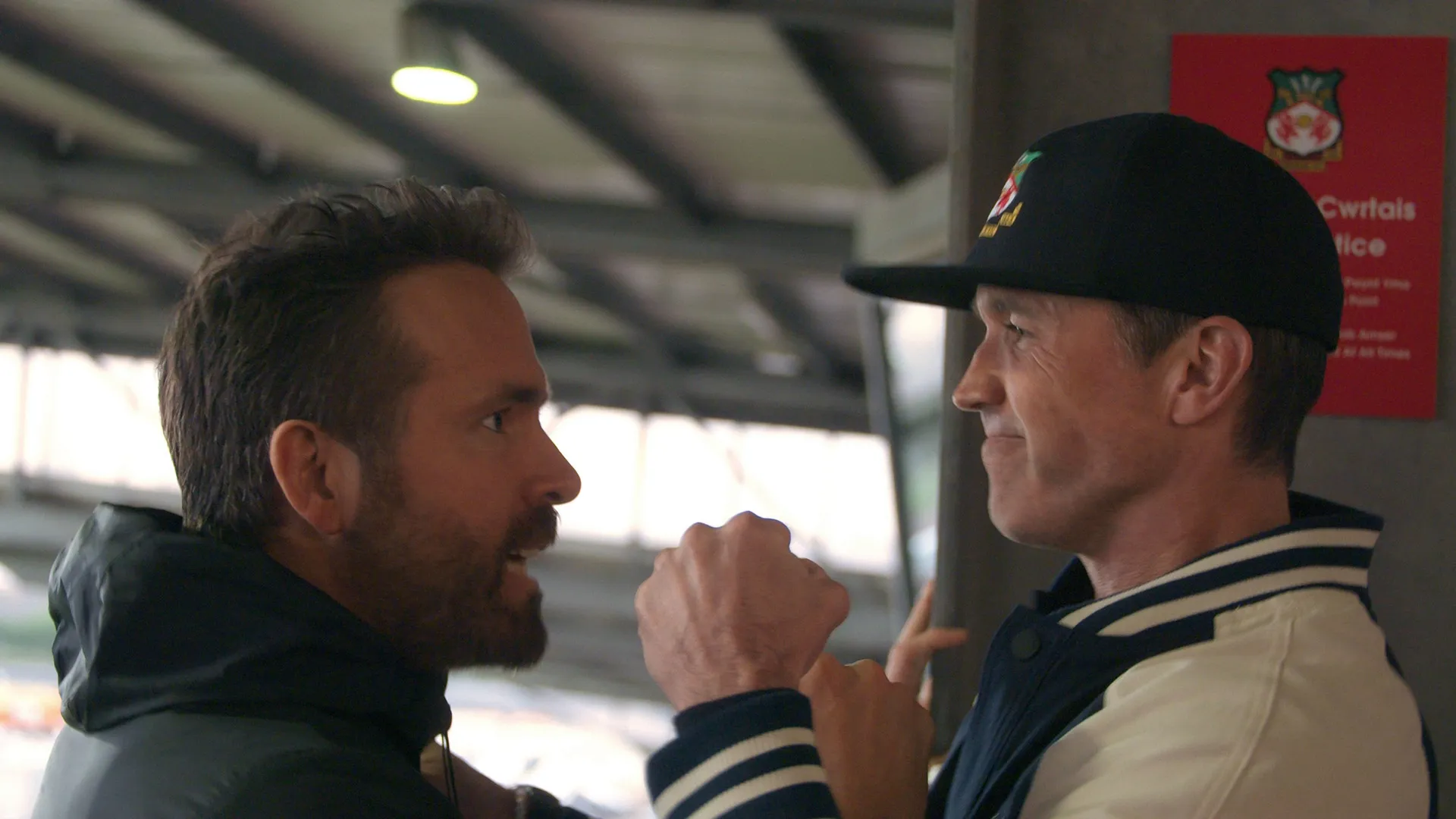 Ryan Reynolds and Rob Mcelhenney celebrating.