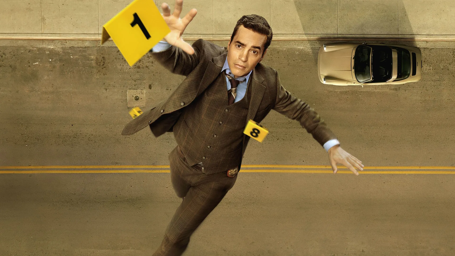 Will Trent (Ramón Rodríguez) falling while reaching for a yellow evidence marker.