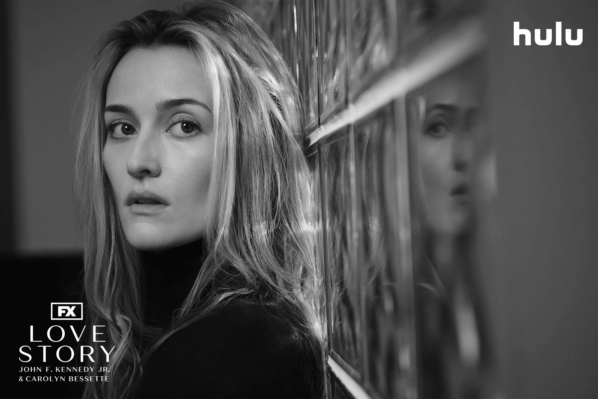 Close-up shot of Carolyn Bessette (Sarah Pidgeon) staring into the camera in FX's Love Story: Carolyn Bessette & John F. Kennedy Jr.