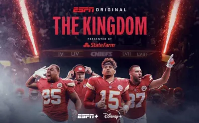 Chris Jones, head coach Andy Reid, Patrick Mahomes, and Travis Kelce running out of the tunnel in front of a crowd.