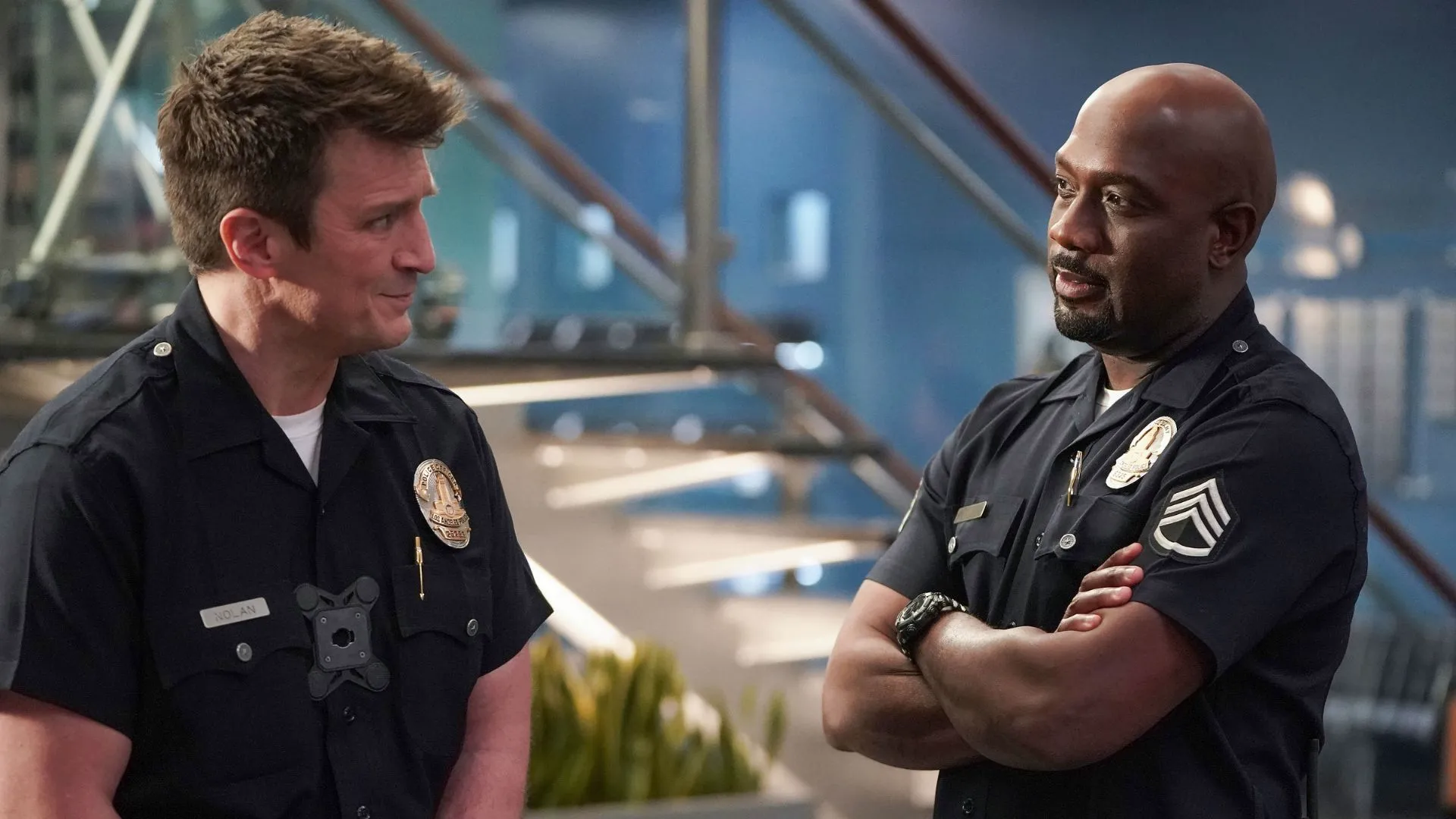 Officer Nolan and Sergeant Grey share a conversation in a scene from The Rookie.