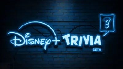 A neon light Disney+ Trivia Beta logo on a brick wall background