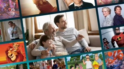 A multi-panel graphic collage displays a central image of a smiling grandfather, father, and young son sitting on a couch eating popcorn together while watching television, completely surrounded by smaller panels featuring iconic movie and TV scenes that celebrate fatherhood, including Coco, Logan, Father of the Bride, Mrs. Doubtfire, The Fantastic Four: First Steps, The Incredibles, The Lion King, Cheaper by the Dozen, Bob's Burgers, Finding Nemo, Modern Family, and Malcolm in the Middle.