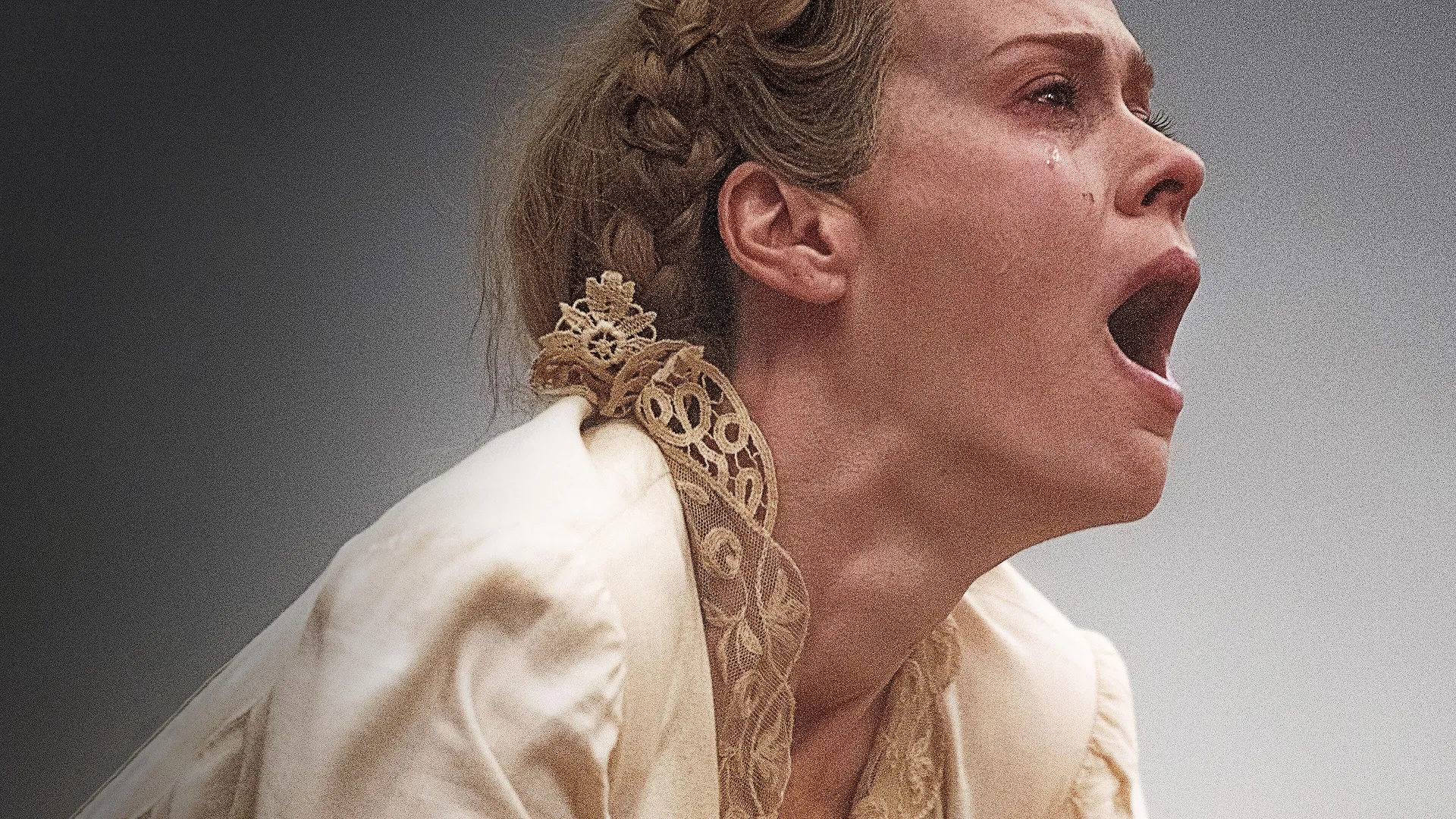 Margaret Bellum (Sarah Paulson) chokes on sand in the air around her.