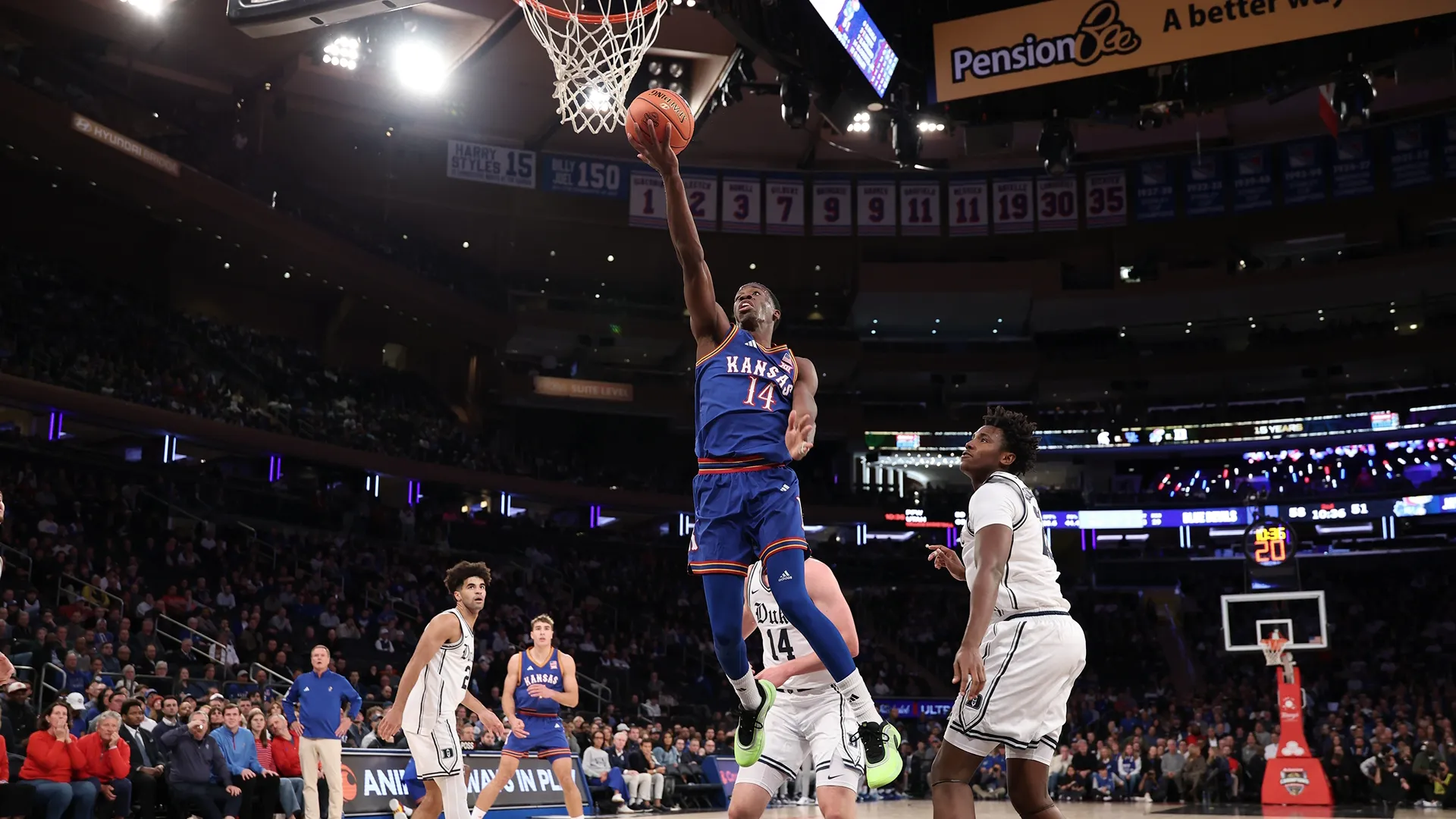 Kansas Jayhawks player, Melvin Council Jr.attempts a layup in a game against the Duke Blue Devils on Nov 18, 2025.