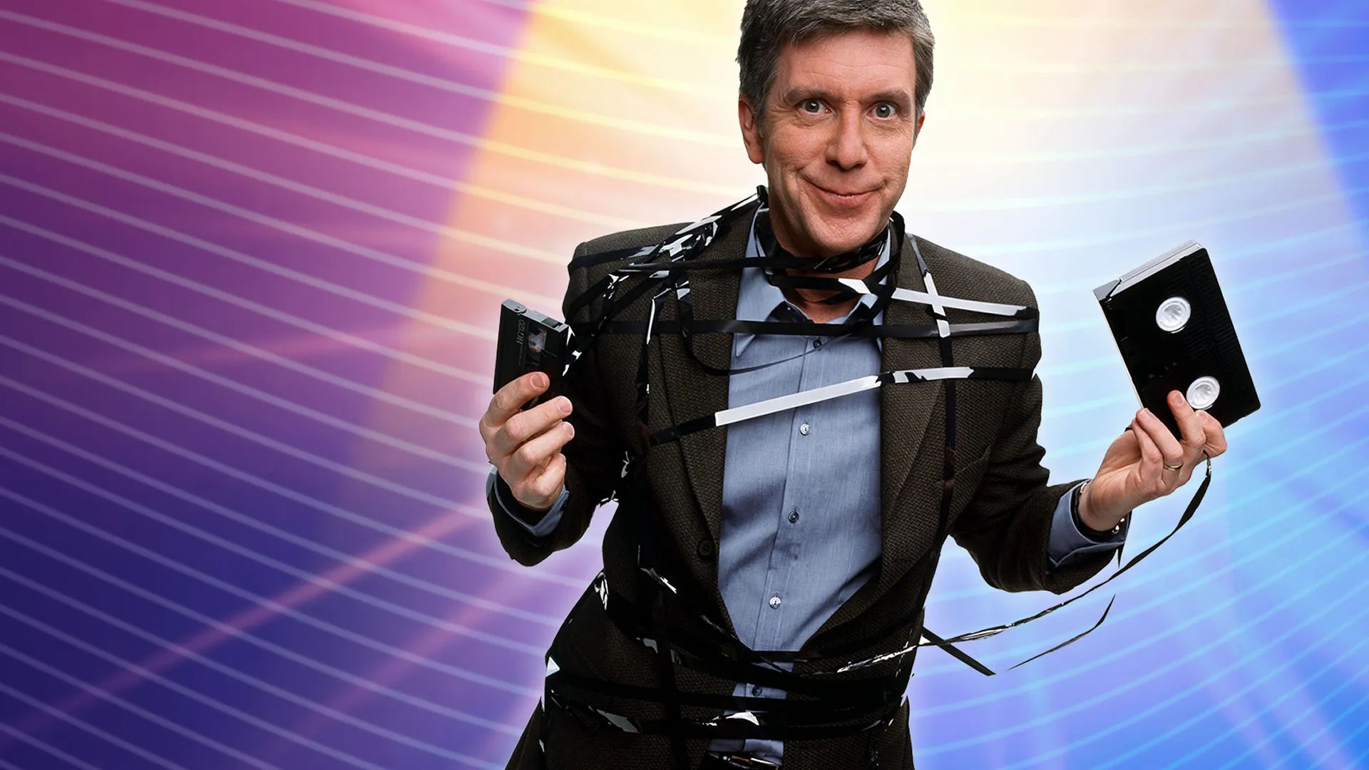 This image features television host Tom Bergeron in a classic promotional image for ABC's hit show America's Funniest Home Videos