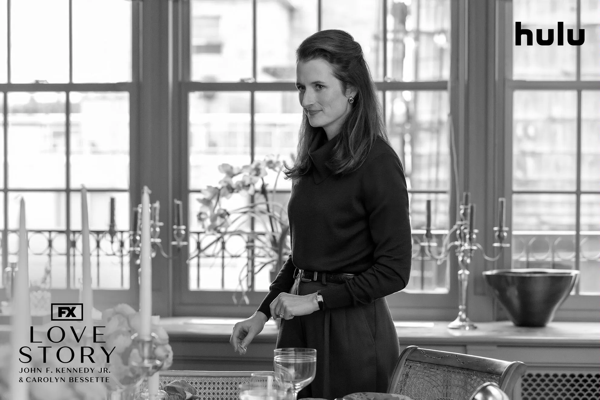 Candid shot of Caroline Kennedy (Mamie Gummer) in a black and white set photo from FX's Love Story.