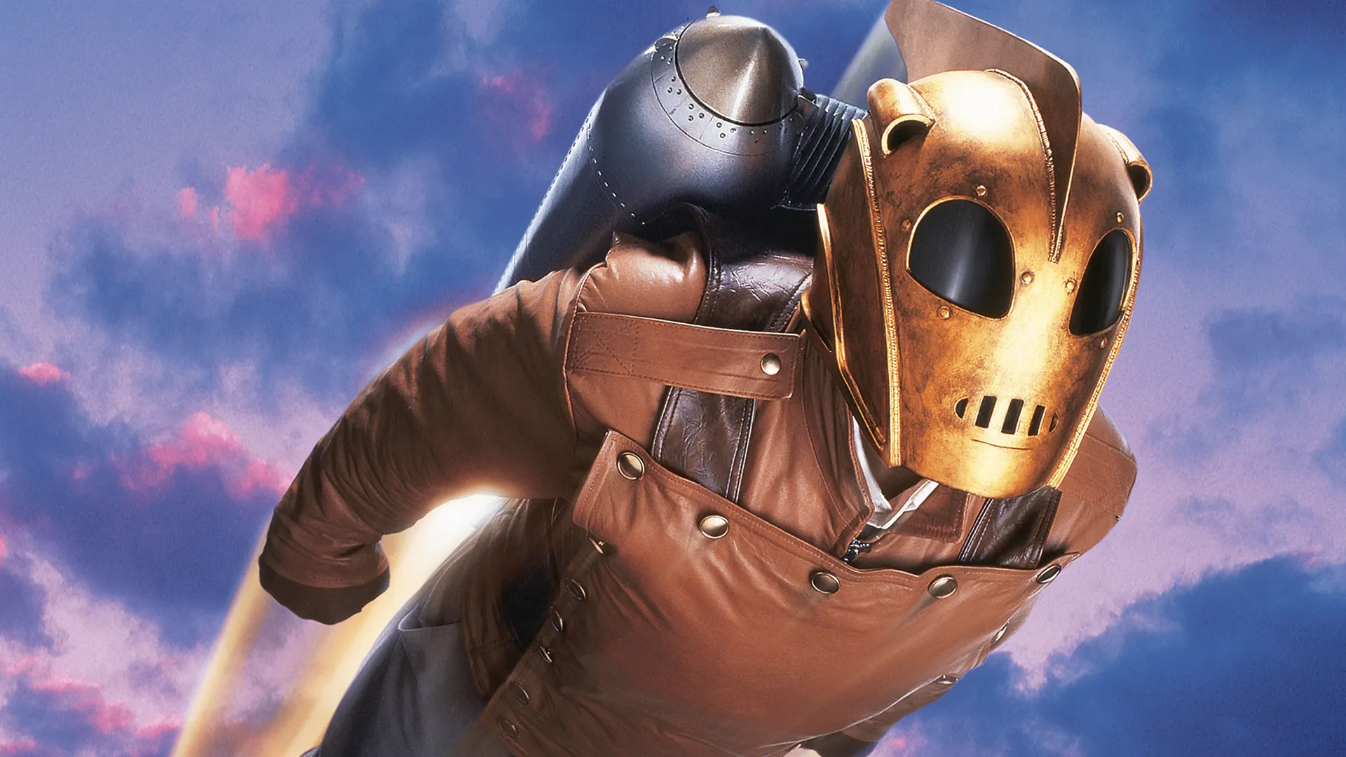 The Rocketeer with his mask and jet pack on, flying through the air