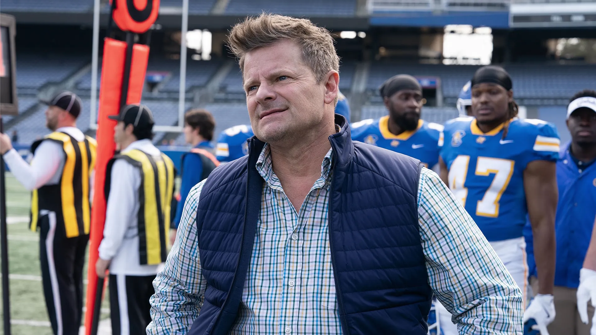 A man standing on the sidelines with the South Georgia Catfish football team in Chad Powers