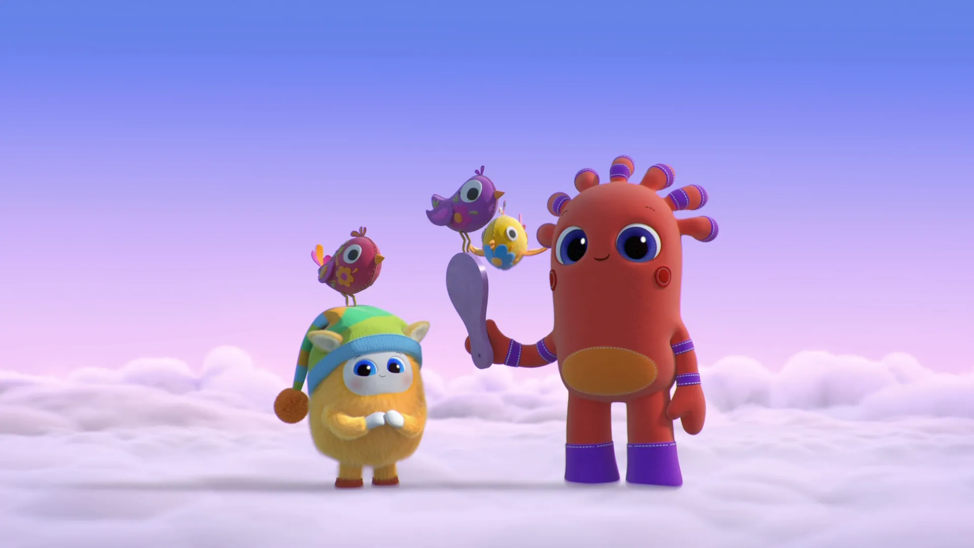 A gentle 3D animated scene from the children's show BeddyByes featuring the tall, orange, stitched character MeMo holding a purple spoon with two small birds perched on it next to the small, yellow, fuzzy character BaBa wearing a striped nightcap on a floor of soft white clouds.