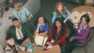 Abbott Elementary main cast promotional photo for Season 6 featuring Janelle James, Lisa Ann Walter, Tyler James Williams, Quinta Brunson, Sheryl Lee Ralph, Chris Perfetti, and William Stanford Davis sat at a table.