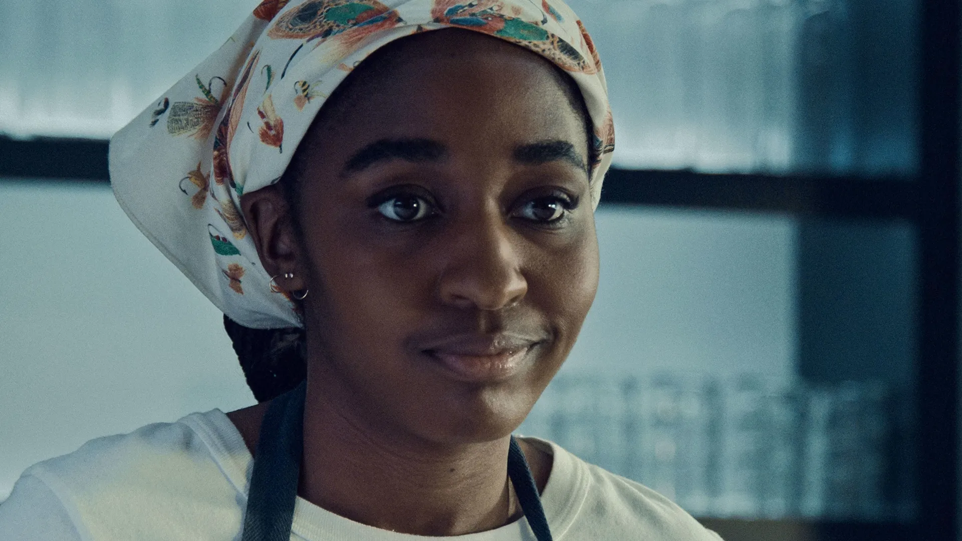 A closeup of Sydney (Ayo Edebiri) in The Bear