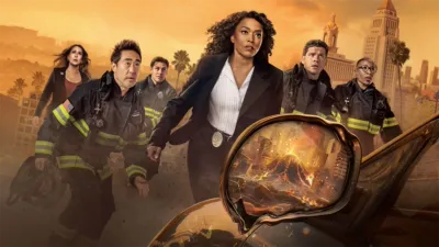 9-1-1 Season 10 promotional art featuring the main cast lead by Athena Grant (Angela Bassey) facing an erupting volcano reflected in a car's melting wing mirror.