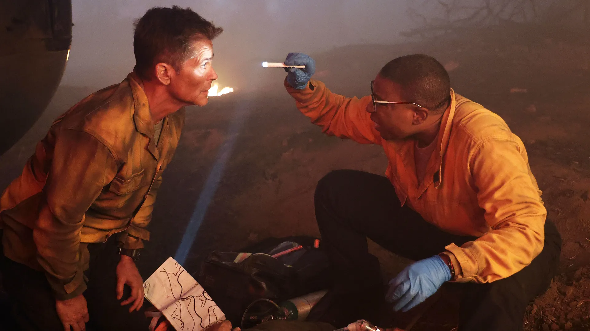 Captain Owen Strand (Rob Lowe) and paramedic Henrietta "Hen" Wilson (Aisha Hinds) during a major crossover event between the TV shows 9-1-1 and 9-1-1: Lone Star.
