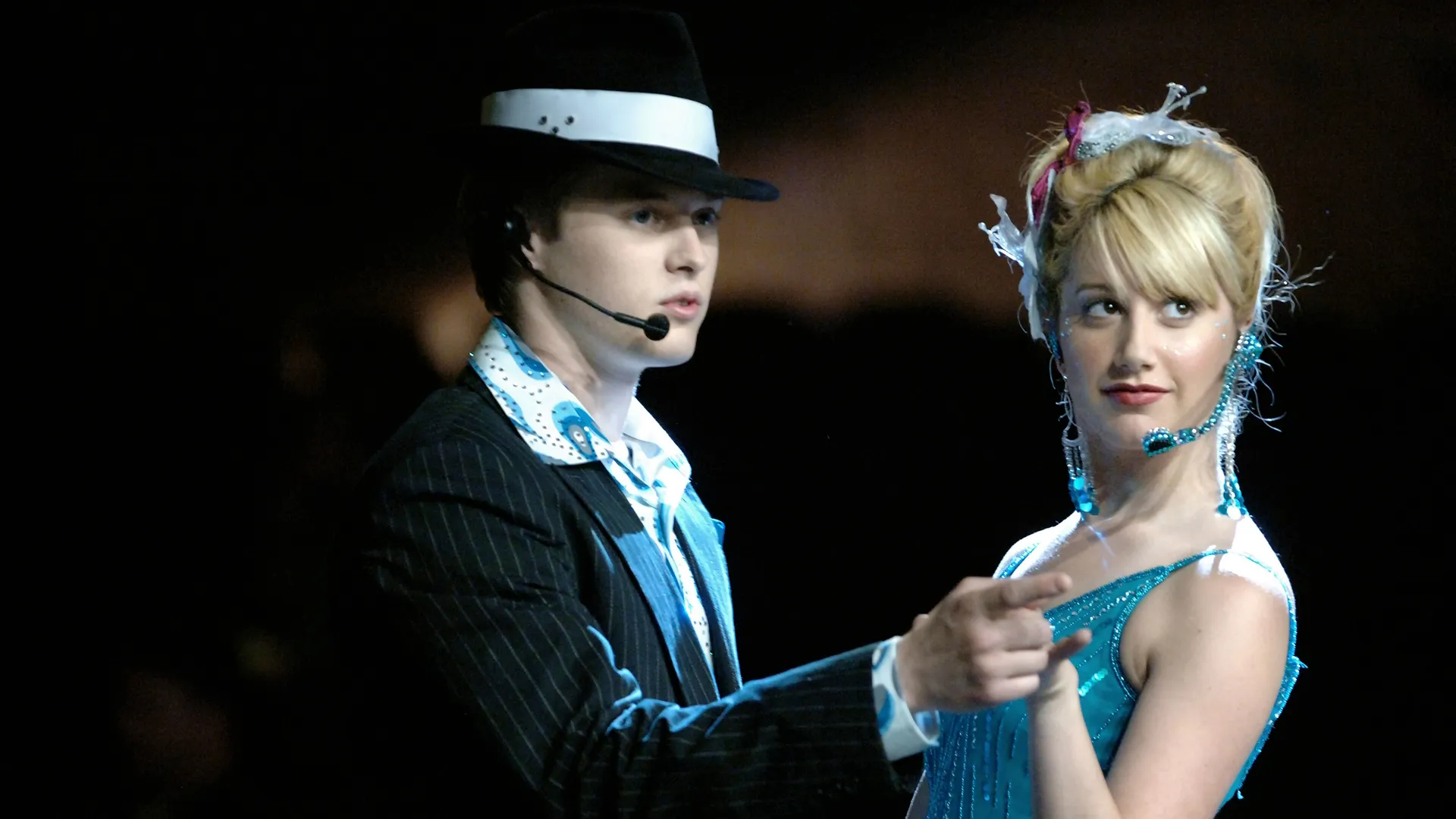 A closeup of Ryan (Lucas Grabeel) performing with Sharpay (Ashley Tisdale) in High School Musical