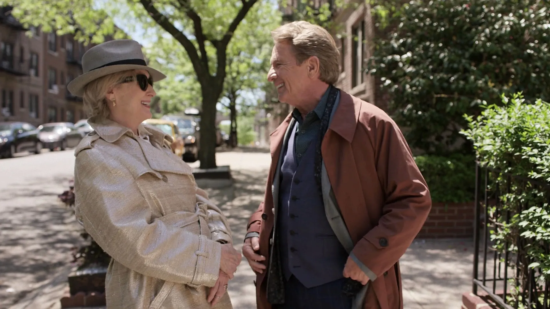 Oliver Putnam (Martin Short) and Loretta Durkin (Meryl Streep) laughing together on a sunny sidewalk