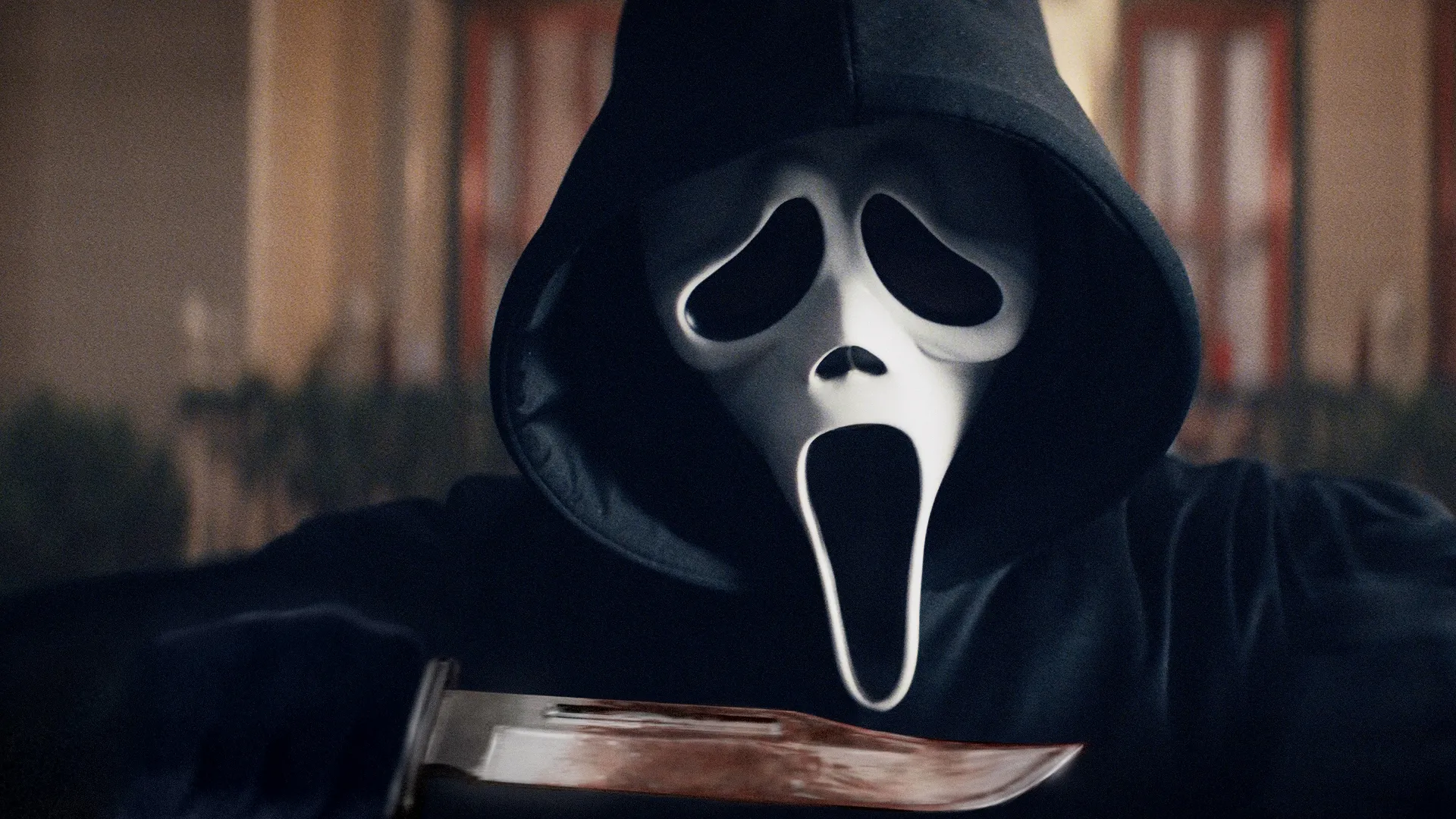 A closeup image of Ghostface's mask in Scream.