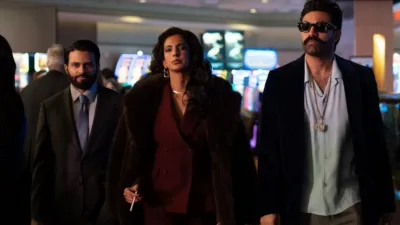 The Dars walk through a casino in the second season of Deli Boys.