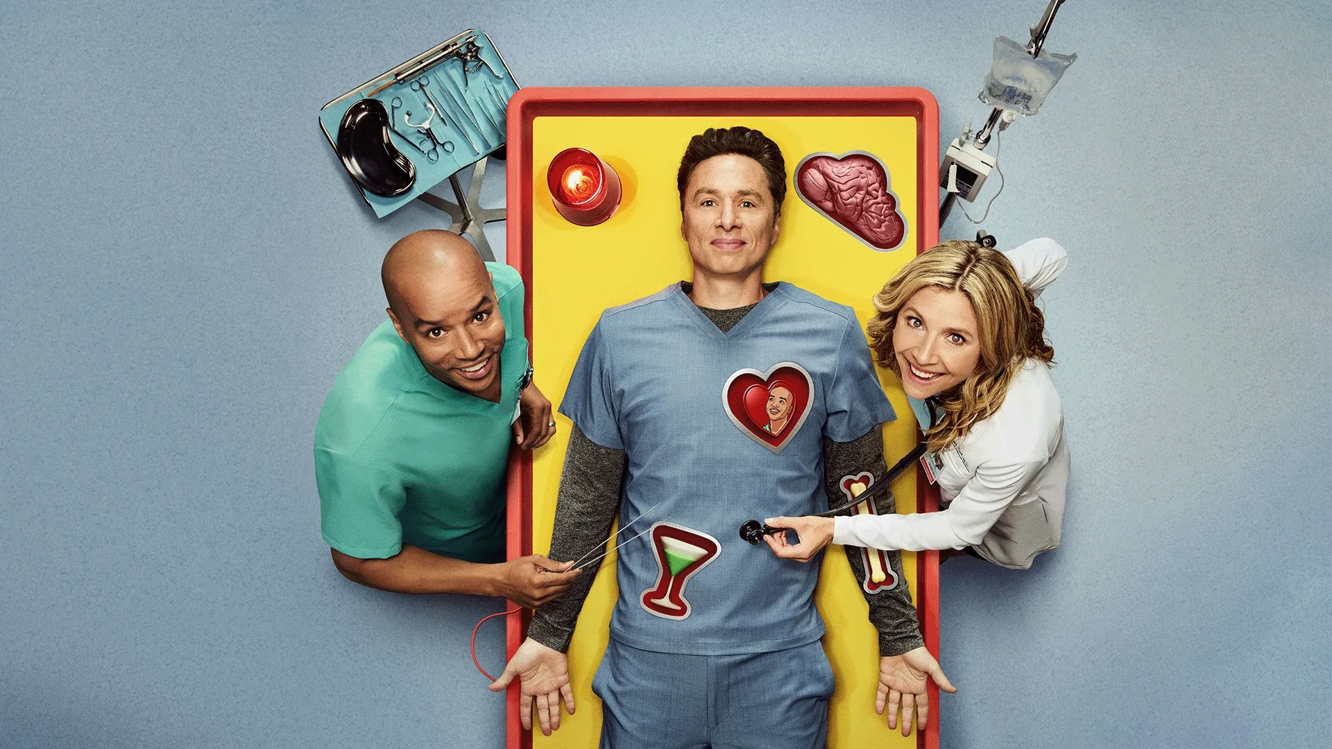 J.D. on a fake operating table with Elliot and Turk at his side.