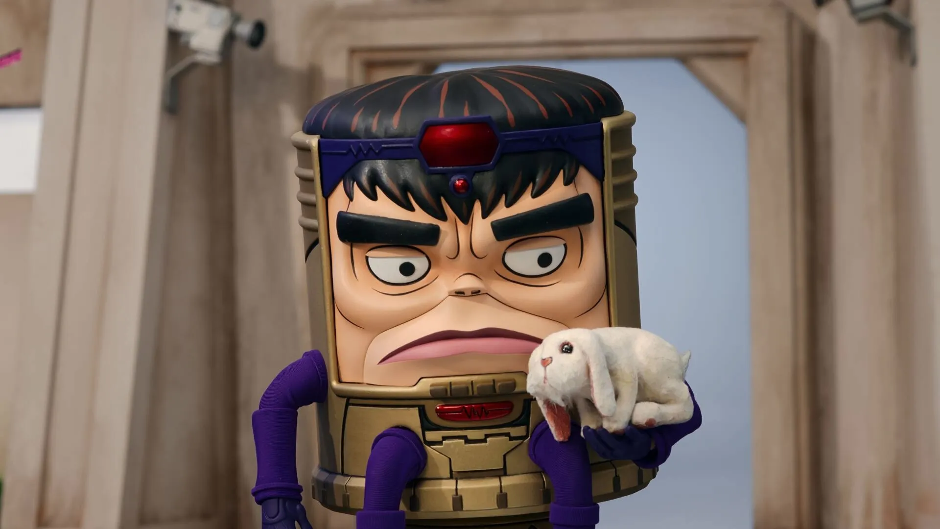 MODOK (Patton Oswalt) holding a white bunny rabbit in M.O.D.O.K animated series