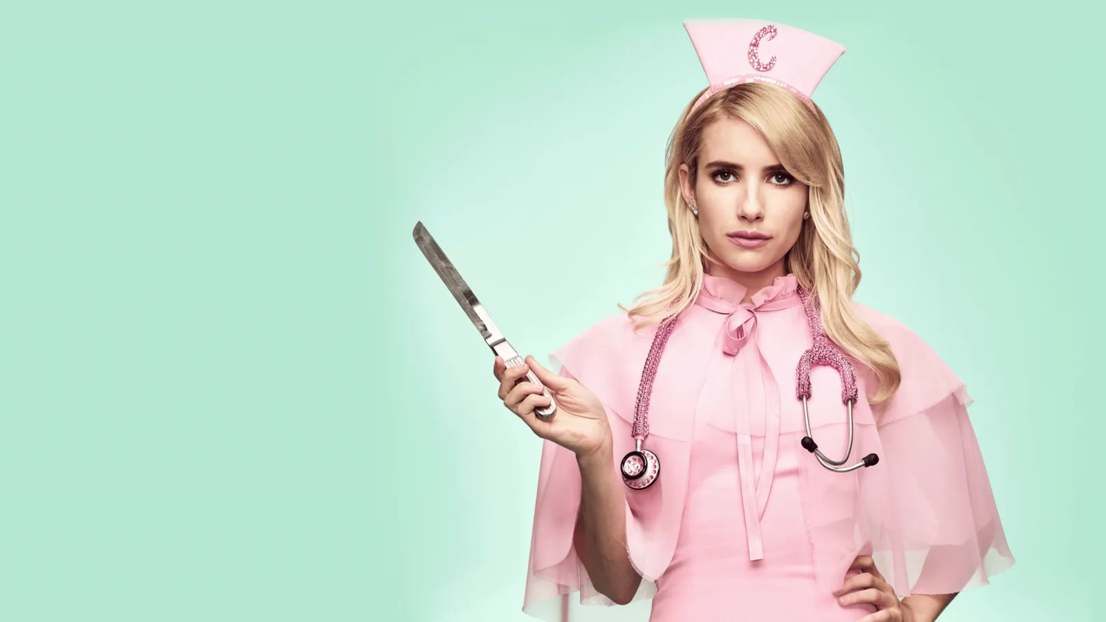 Chanel Oberlin dressed as a pink nurse and holding a large surgical knife against a mint-green background
