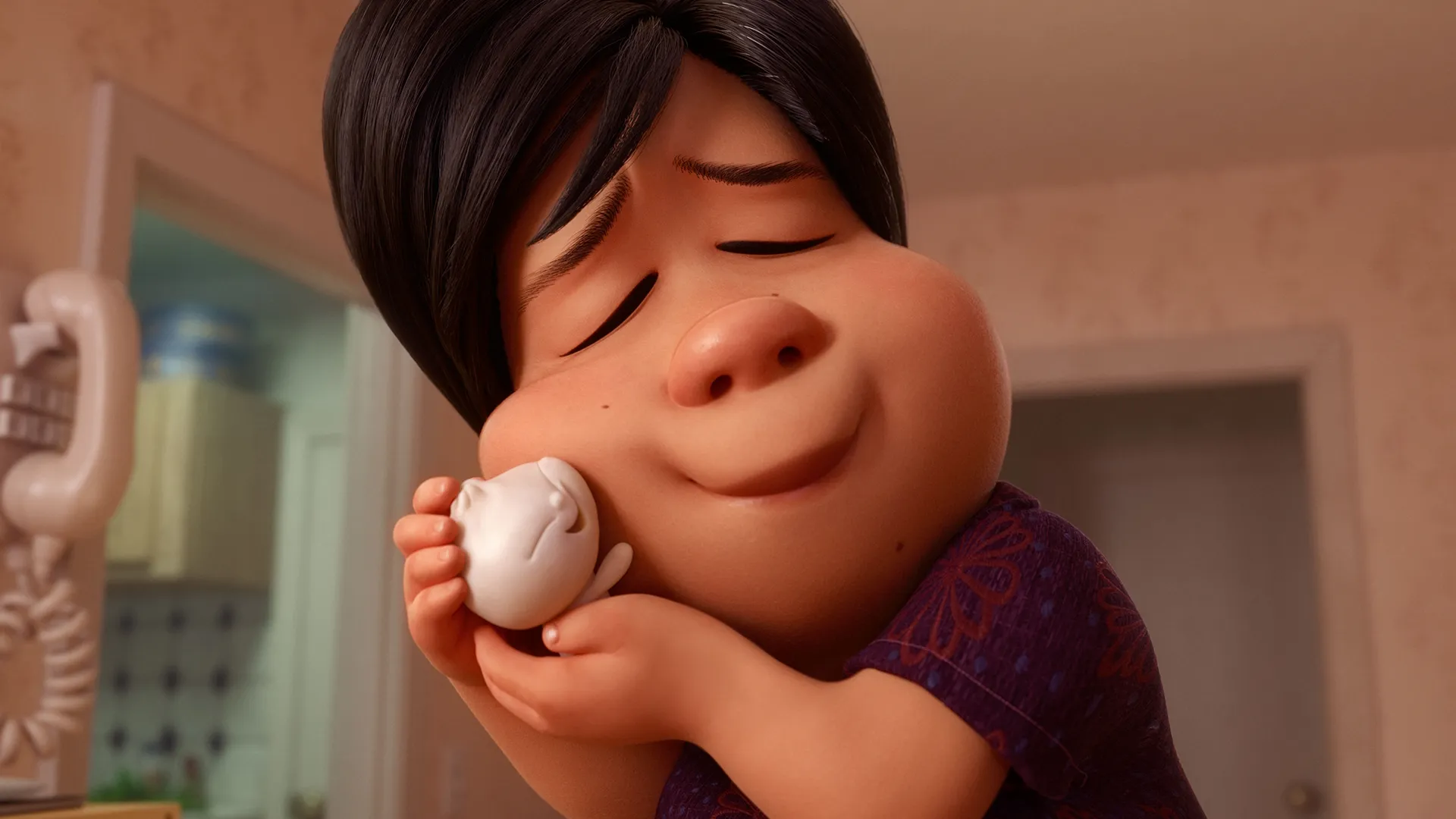 A woman holds a small childlike Bao in an embrace