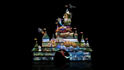 Key art for Disney Worldbuilders featuring the iconic Walt Disney Pictures castle logo with various Disneyland attractions showcased in the outline of the castle.