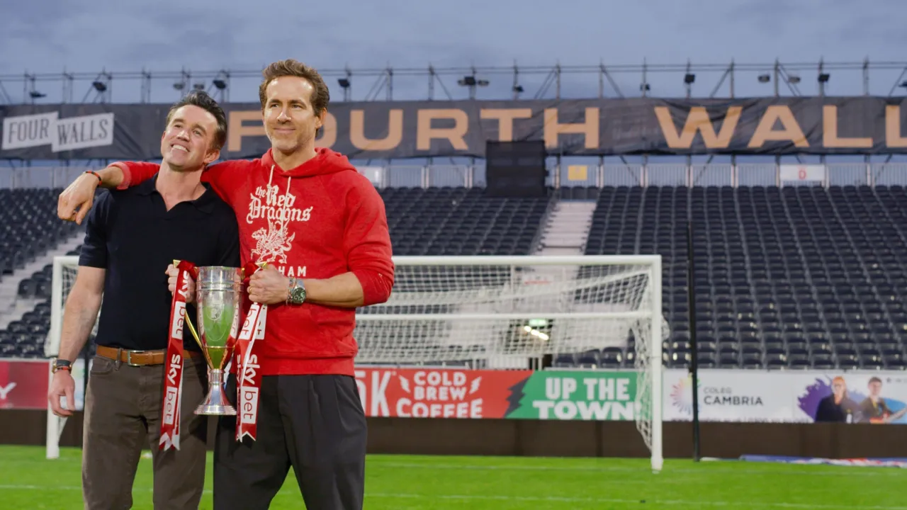 Rob Mac and Ryan Reynolds holding a trophy