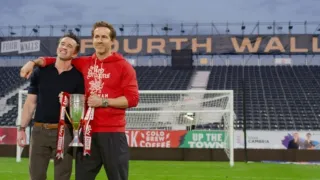 Rob Mac and Ryan Reynolds holding a trophy