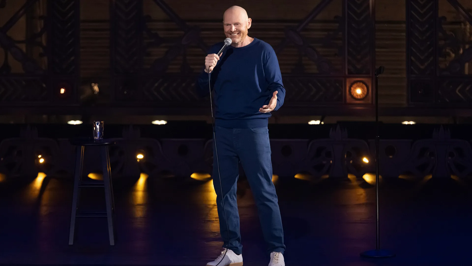 Comedian Bill Burr on stage doing his stand-up routine.