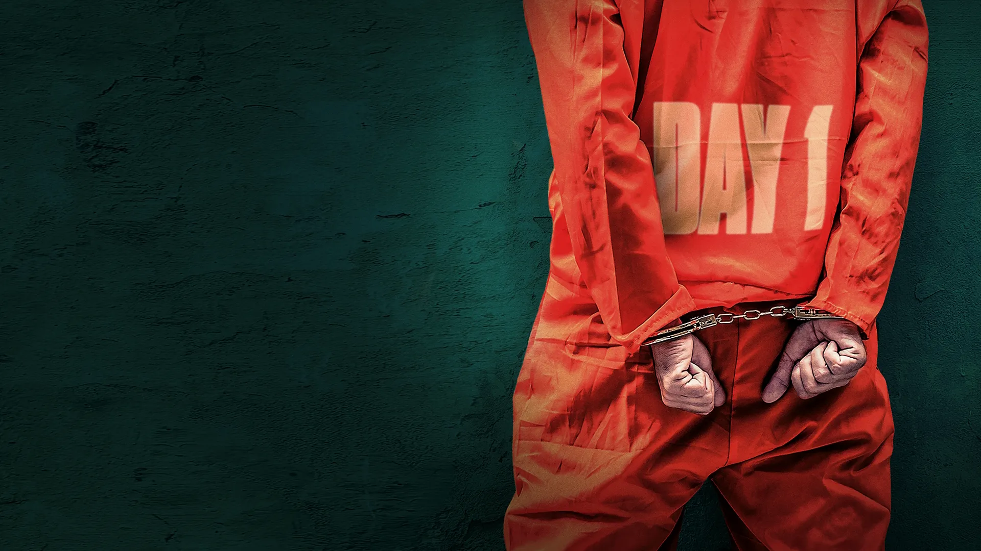 An official key art poster graphic for the A&E reality documentary television series Booked: First Day In, featuring the back of an inmate clad in a bright orange jumpsuit with "DAY 1" stamped on the back and hands secured in metal handcuffs against a textured dark teal background.