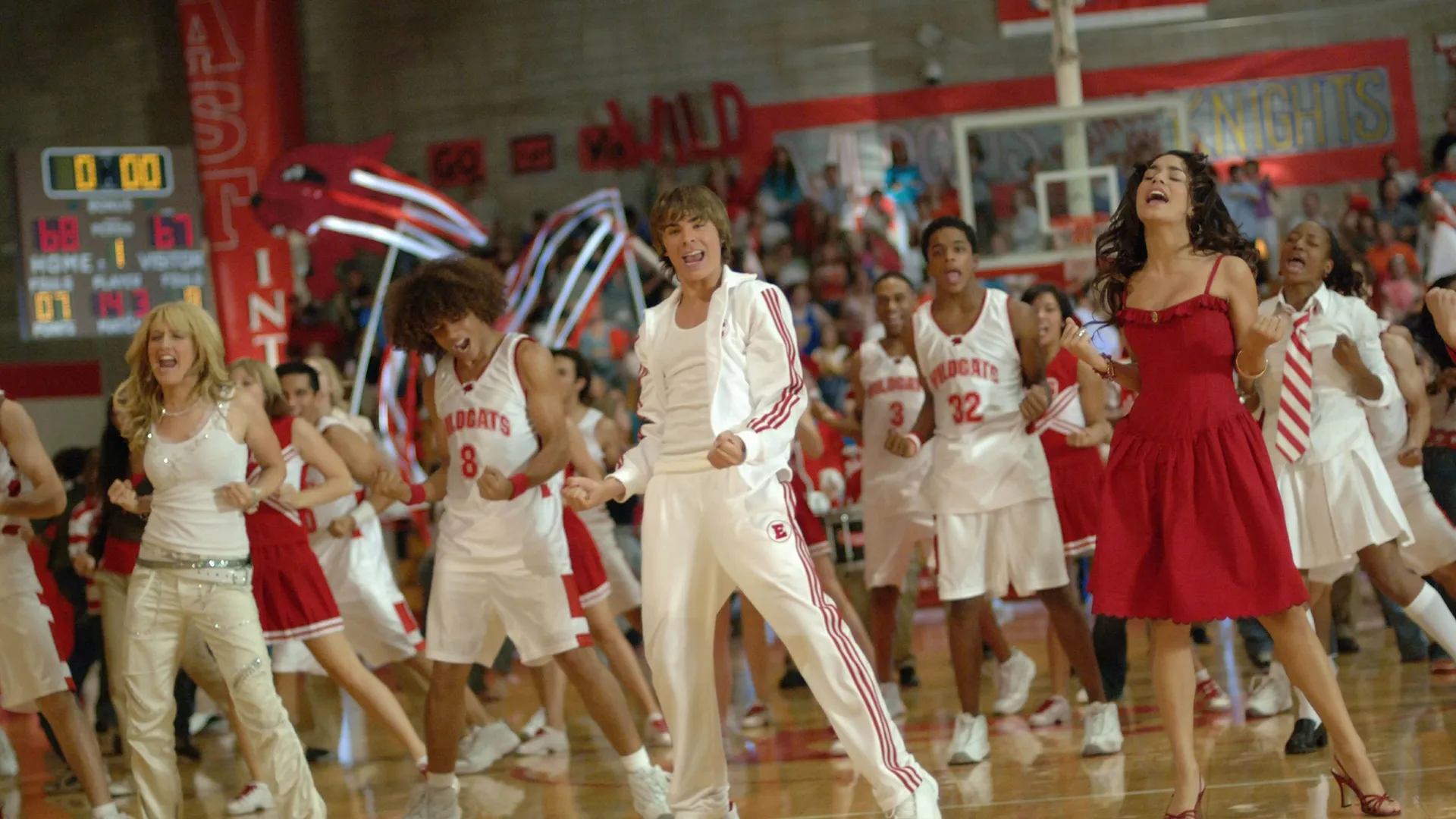 The cast of High School Musical performs a musical number in their school gymnasium