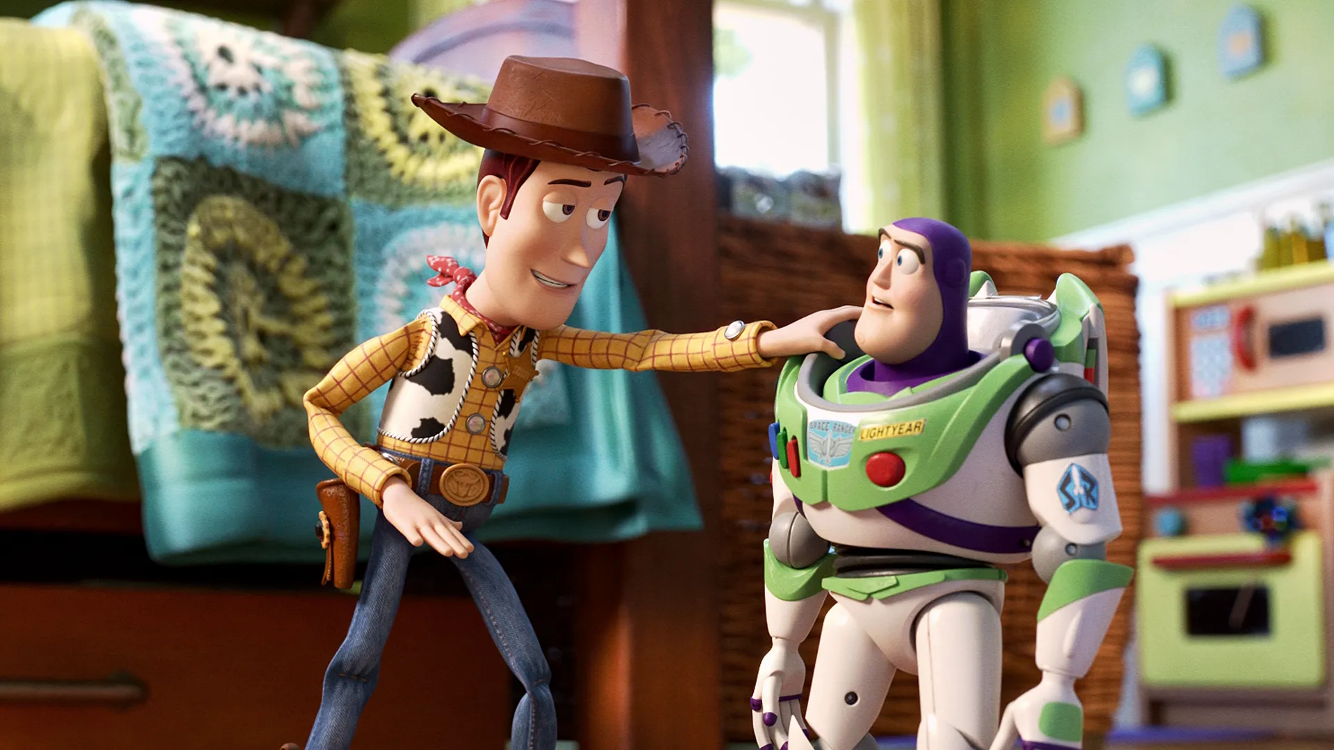 The toy cowboy Woody smiles and places a hand on the shoulder of the space ranger toy Buzz Lightyear inside a brightly lit child's bedroom, in a still from the animated film Toy Story 4.