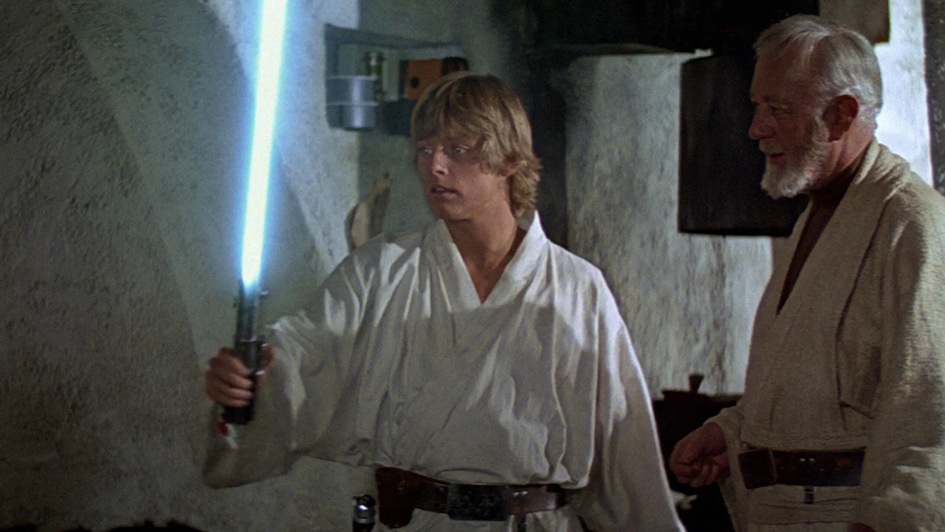 Luke Skywalker (Mark Hamill) e Obi-Wan Kenobi (Alec Guinness) em Star Wars: Uma Nova Esperança