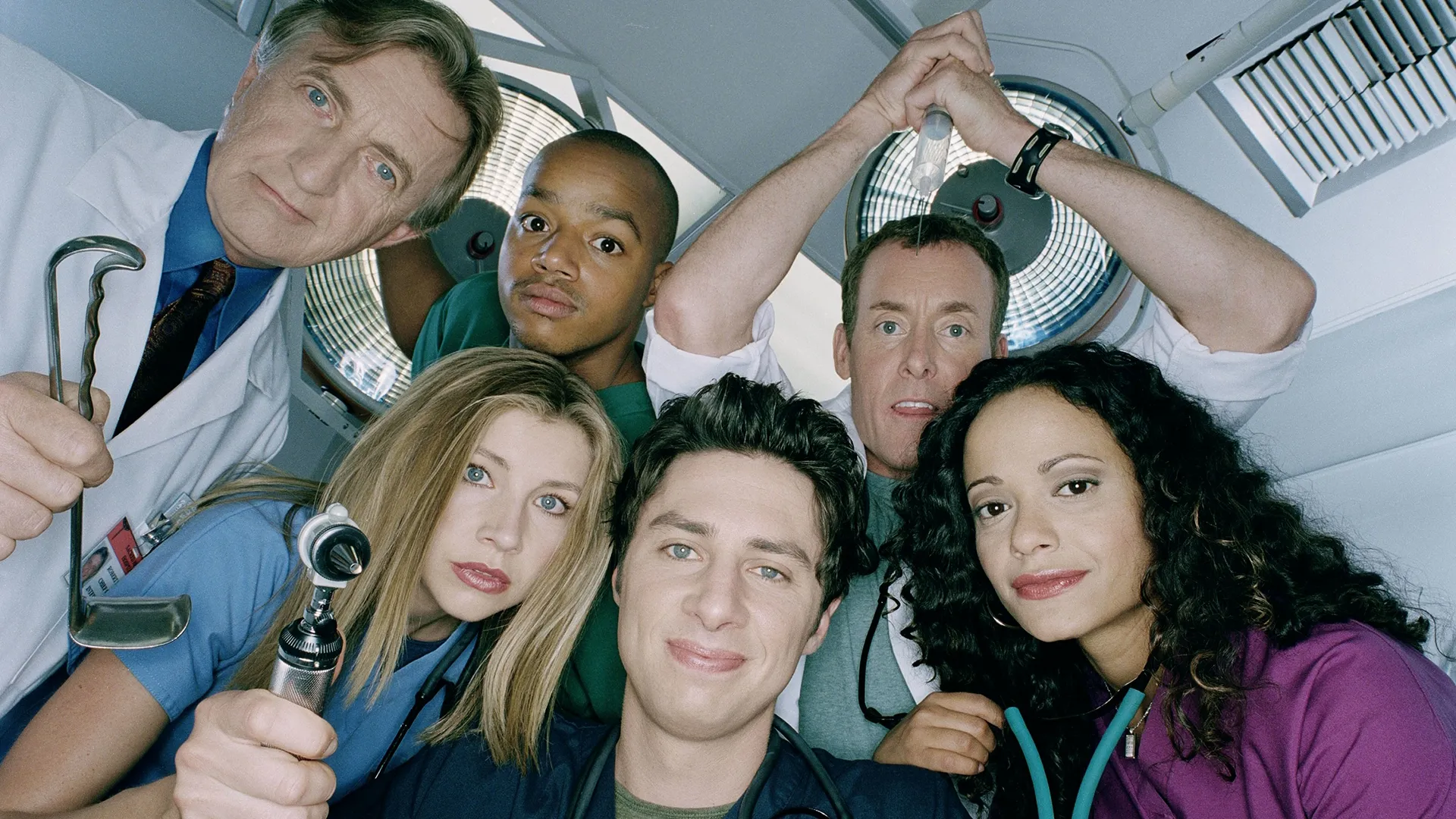 The cast of Scrubs (2001) including Zach Braff, Judy Reyes, Donald Faison, and Sarah Chalke