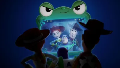 An official promotional poster for Disney and Pixar's "Toy Story 5" features Woody and Jessie from behind, looking at a green frog-themed tablet that shows a video call from Buzz, Woody, and Jessie looking concerned.