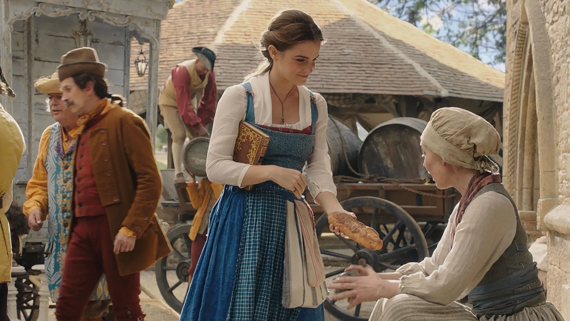 Emma Watson as Belle in the 2017 live-action film Beauty and the Beast, wearing a signature blue and white provincial dress.