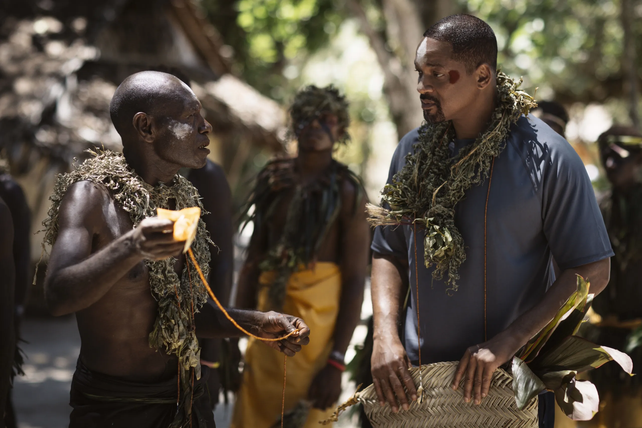 Will Smith, right, learns about the history of the area from Marine Ecologist John Aini. (credit: National Geographic/Freddie Claire)