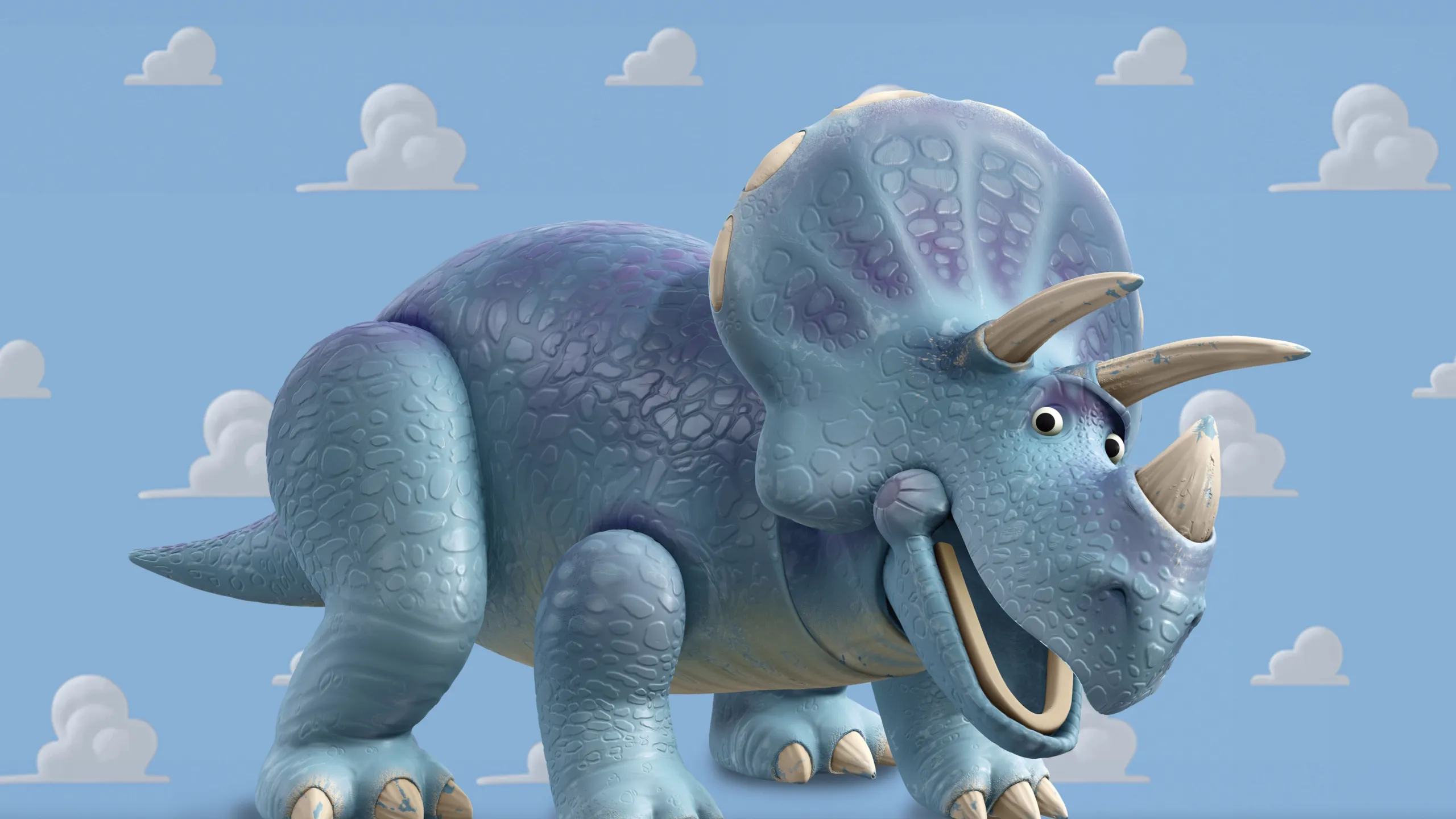 A blue plastic Triceratops toy