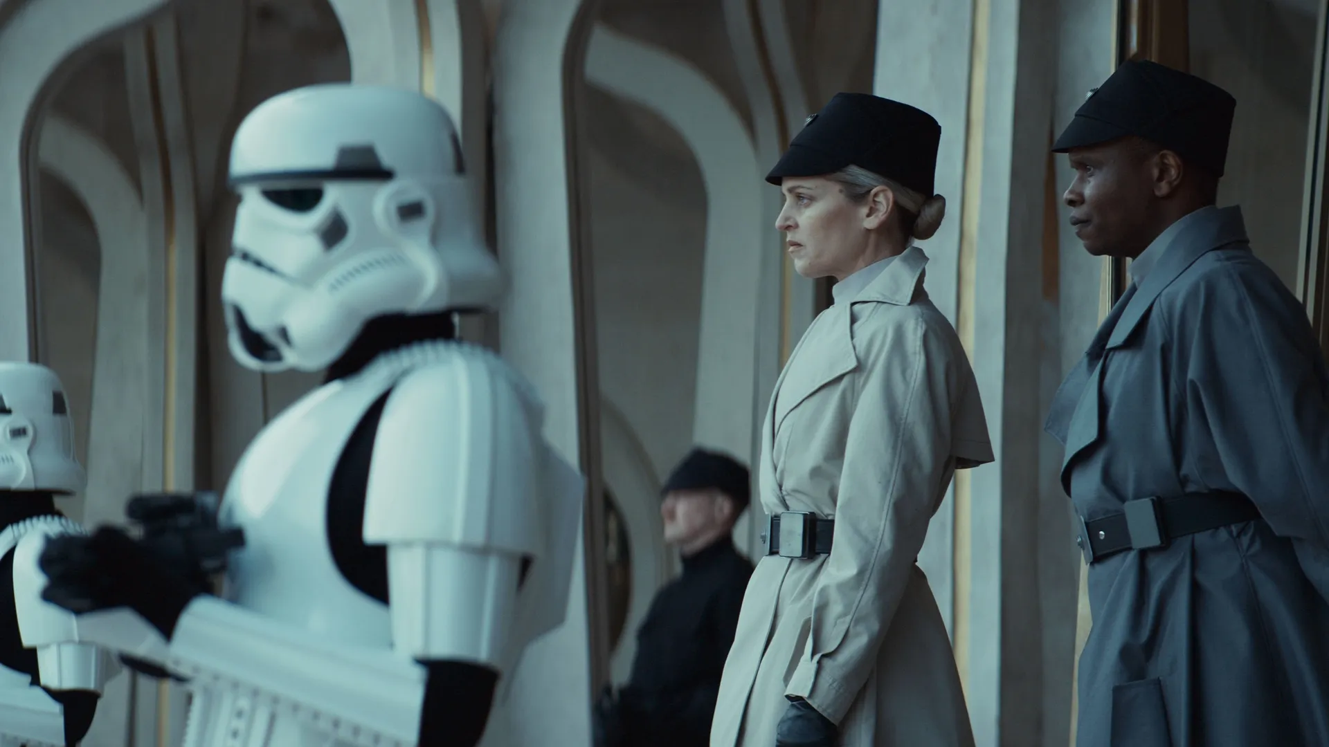 ISB officer Dedra Meero (Denise Gough) and Imperial forces overlook the protests in the plaza before the chaos erupts.
