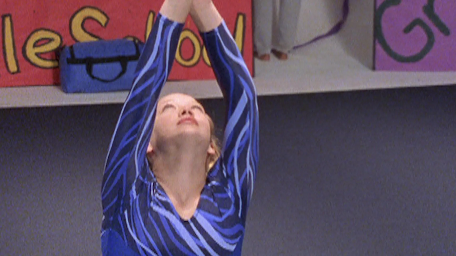 Lizzie McGuire performs a gymnastics routine in the Season 1 episode I've Got Rhythmic