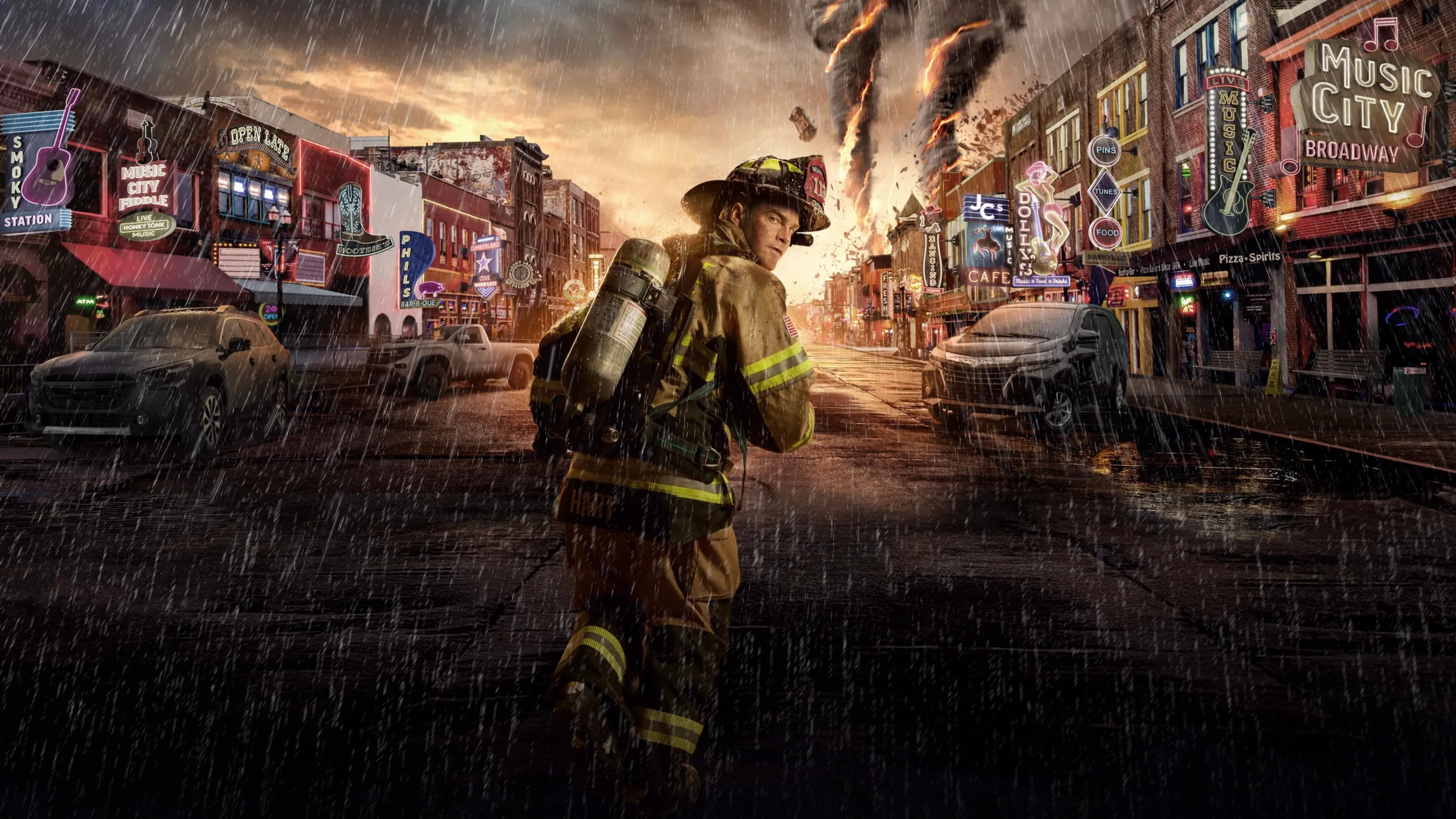 Captain Don Hart (Chris O'Donnell), dressed in a fireman's uniform, runs down a Nashville main street with a flaming tornado in the background.