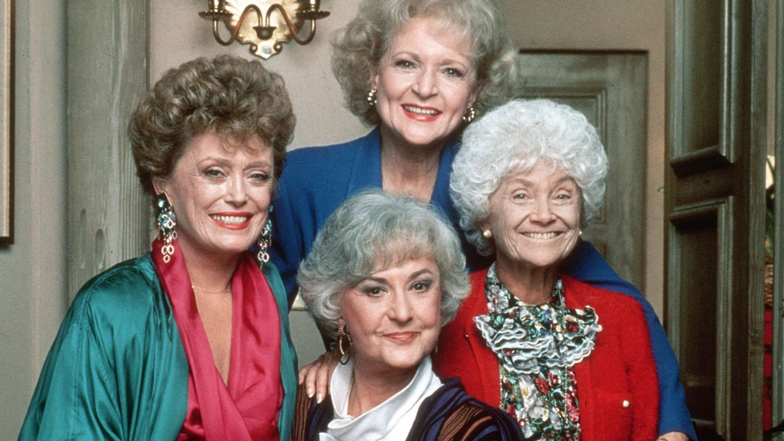 The Golden Girls beam as they pose for a group picture.