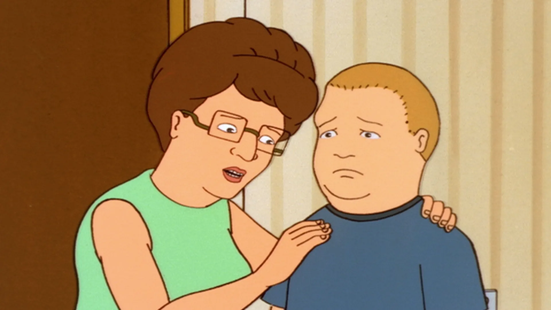 Peggy (Kathy Najimy) places a reassuring hand on a worried Bobby (Pamela Adlon).