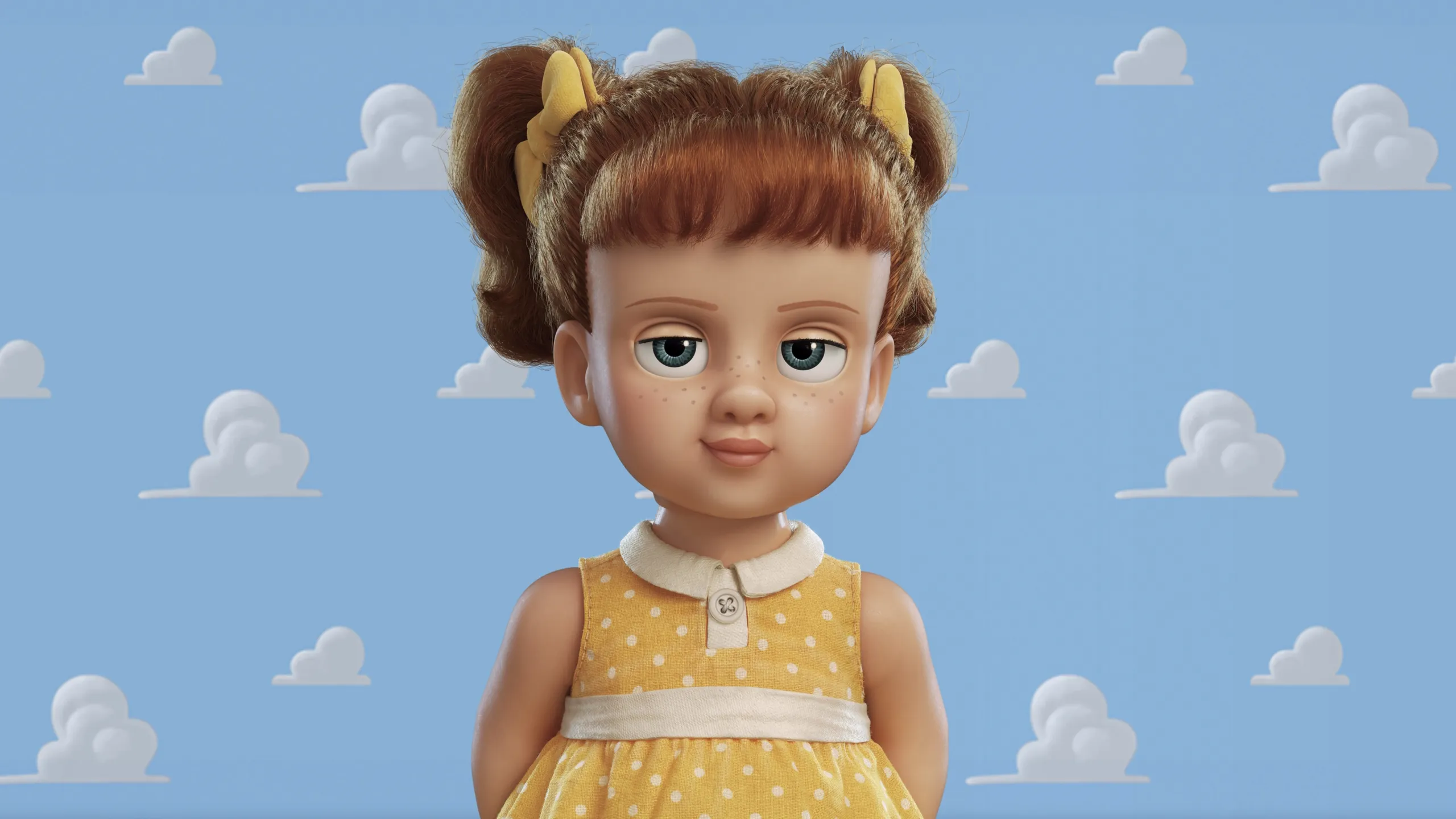 A little girl doll wearing a yellow dress and pigtails with bows
