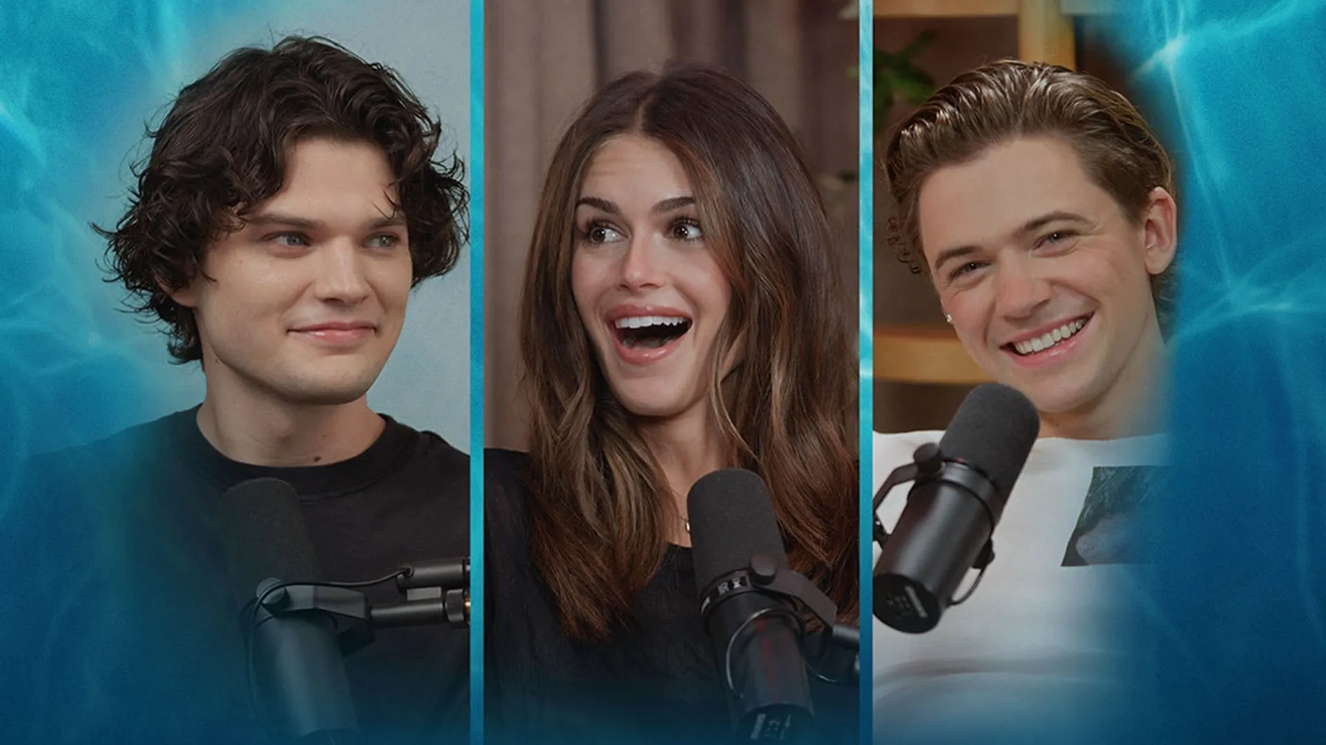 A three-panel split image from The Shards Official Podcast featuring cast members Igby Rigney smiling subtly on the left, Kaia Gerber reacting with wide-eyed excitement in the center, and Homer Gere laughing on the right, each seated behind a podcast microphone against a blue water-ripple background overlay