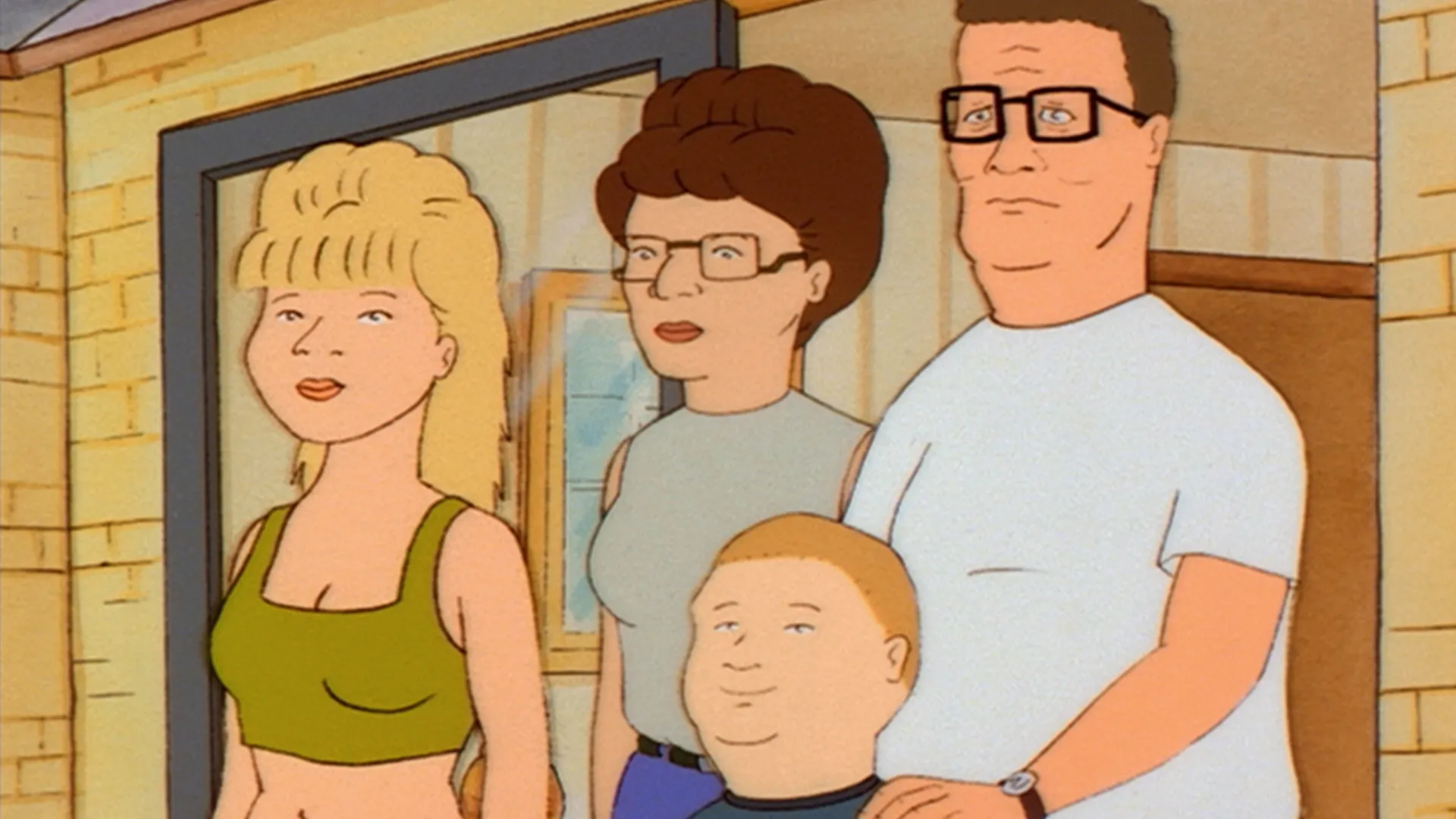 Luanne (Brittany Murphy), Peggy (Kathy Najimy), Bobby (Pamela Adlon), and Hank (Mike Judge) stand together in the Hill family’s doorway.