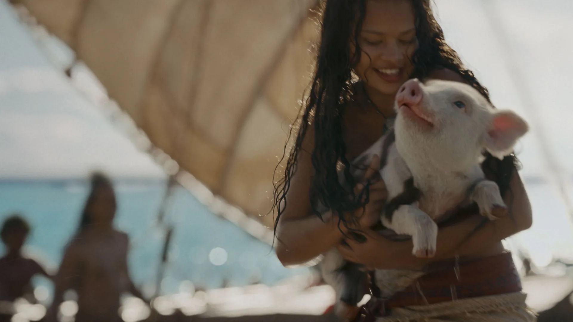 Moana carrying her pig, Pua.