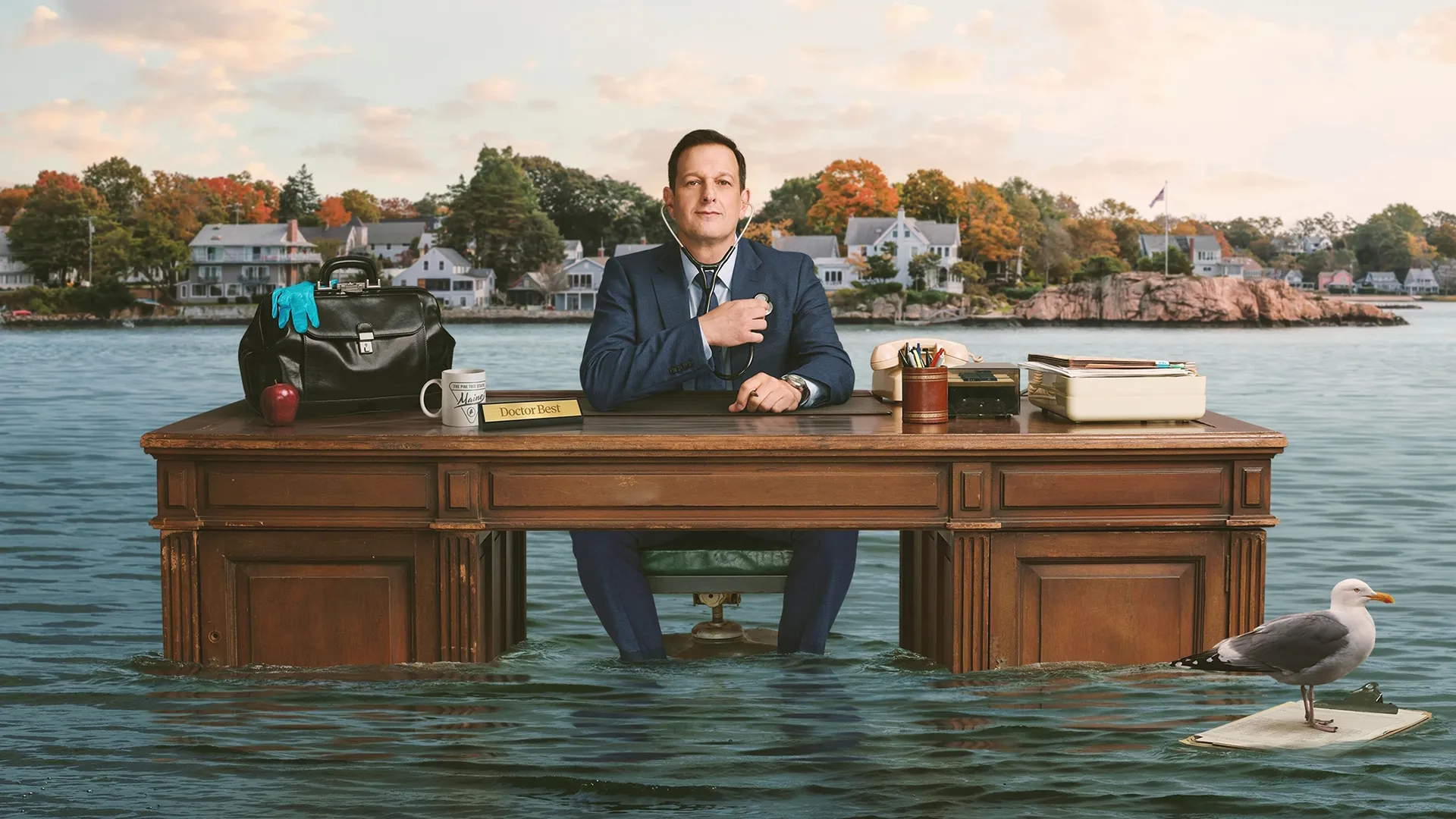 Doctor Martin Best (Josh Charles) sitting at his desk in the middle of a body of water in promotional art for Best Medicine.